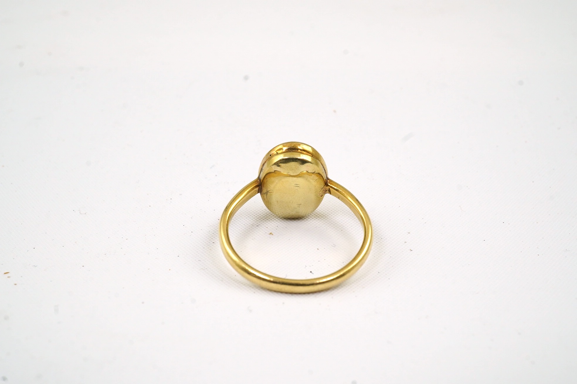 An 18ct gold and single stone oval cabochon opal set ring